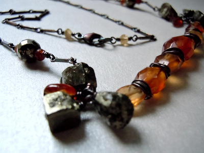 Image Sculpted Pyrite and Hessonite Gemstones