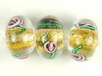 Image Czech Handmade Lampwork rondell 12 x 8mm gold foil with purple flowers